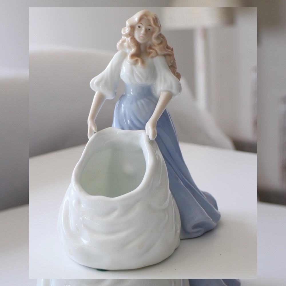 charming porcelain maiden figurine holding bag